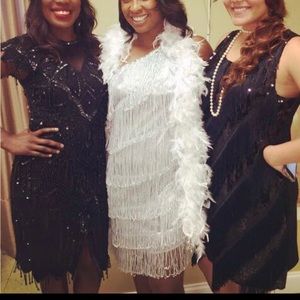 Black beaded dress on the left